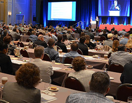 An image of the 2016 National Nonprofit Conference, showing hundreds of our guests at tables, listening to Mike Batts and panel speakers discuss accounting and law topics for nonprofit organizations